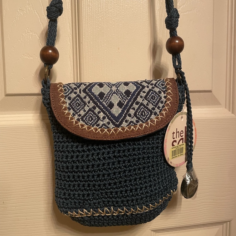 Denim blue “the Sak” bag  length 8 inch  x width 7 inch strap drop 22.5 inch.
